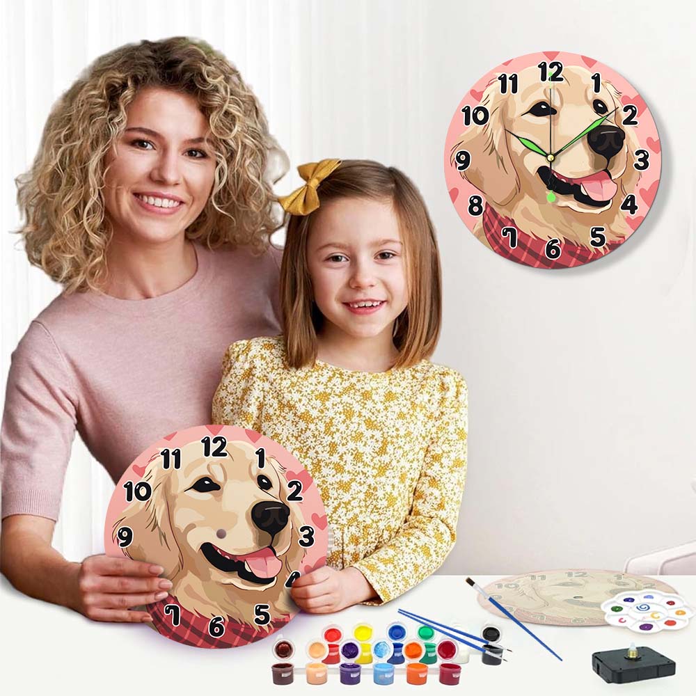Woman and child holding dog-themed wall clocks with painting supplies on a table.