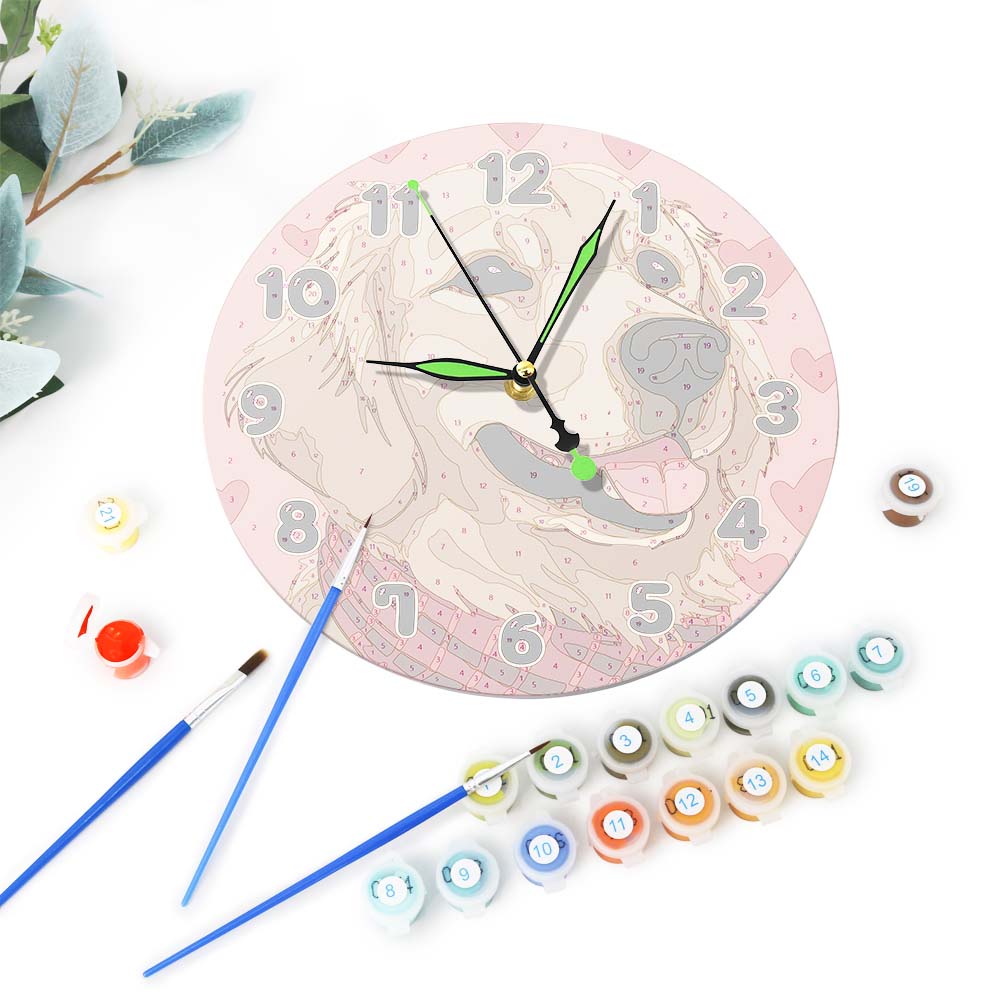 Decorative clock with paint bottles and brushes on a white background