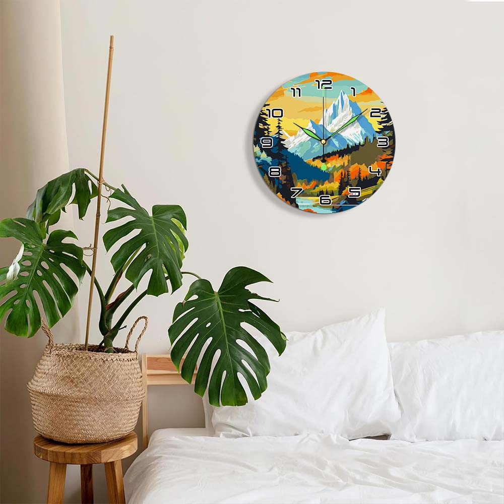 Decorative wall clock with mountain design in a bedroom setting