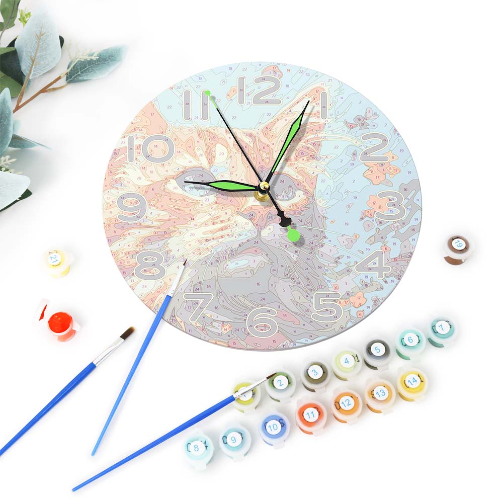 Decorative clock with paint cans and brushes on a white background