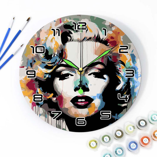Colorful wall clock with artistic design of a face, surrounded by art supplies.