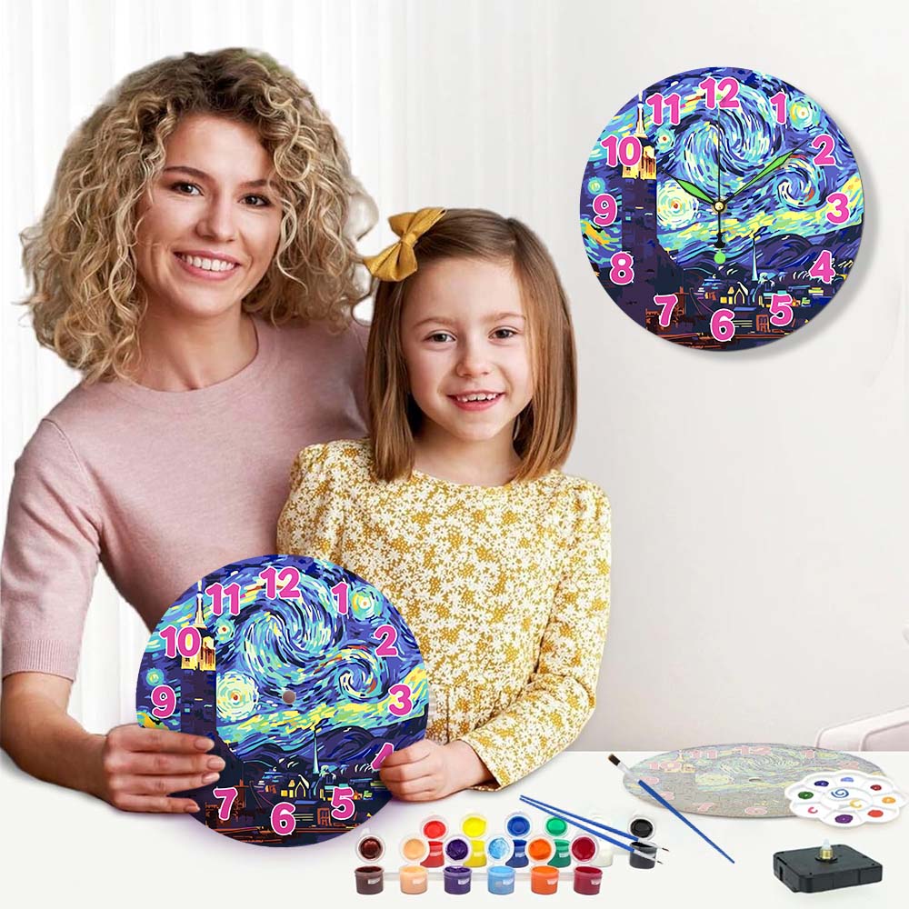 Woman and child holding a painted clock with art supplies on a table.