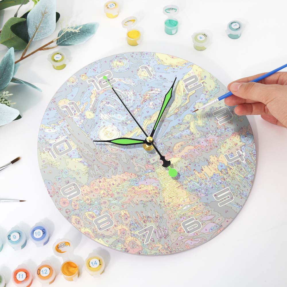 Person painting a round clock with colorful paint on a white surface.