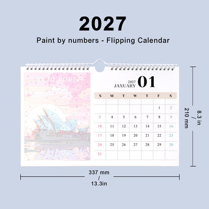 A 2027 flipping calendar desk planner shown with dimension labels on a light blue background. The calendar page features a pastel pink Sydney house illustration on the left and a January 2027 calendar grid on the right.