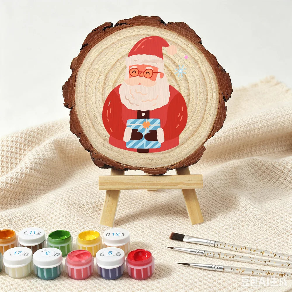 
Paint by Numbers - Wood Slice | Santa with a Blue Gift