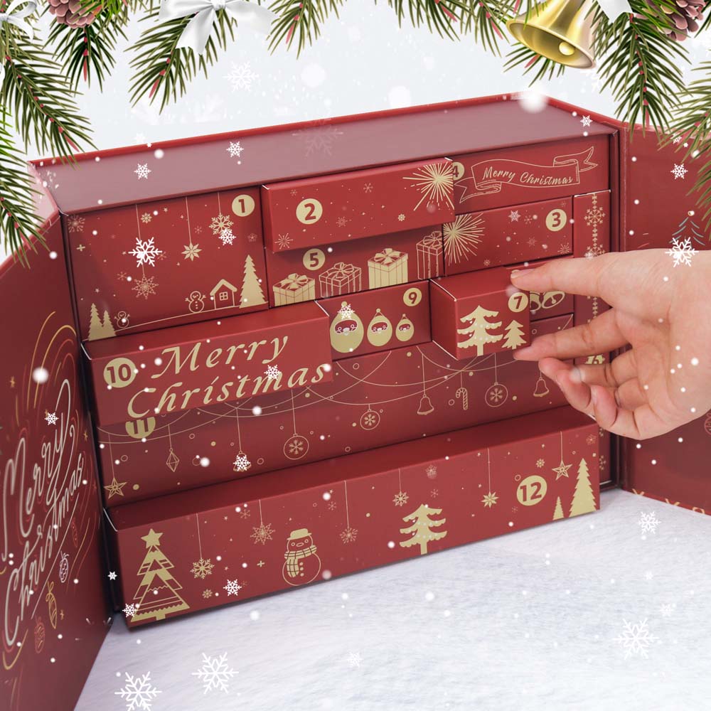Red advent calendar with gold Christmas designs, hand pointing to a drawer, surrounded by festive decorations.