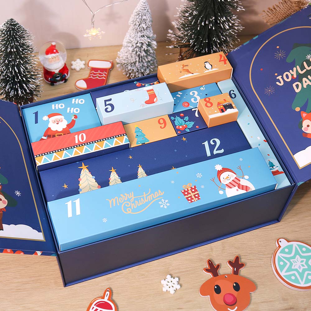 Open Christmas advent calendar with festive designs on a wooden surface.
