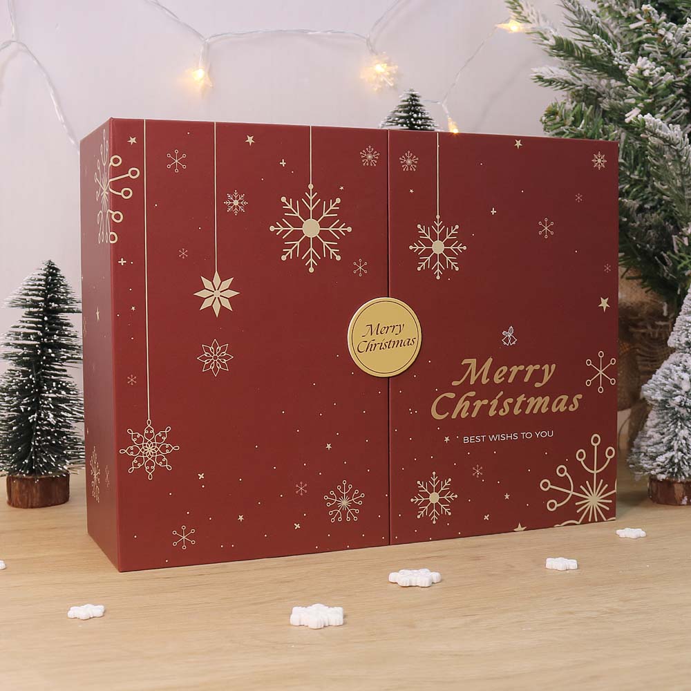 Red Christmas box with snowflake designs and 'Merry Christmas' text, set against a festive background with Christmas trees.