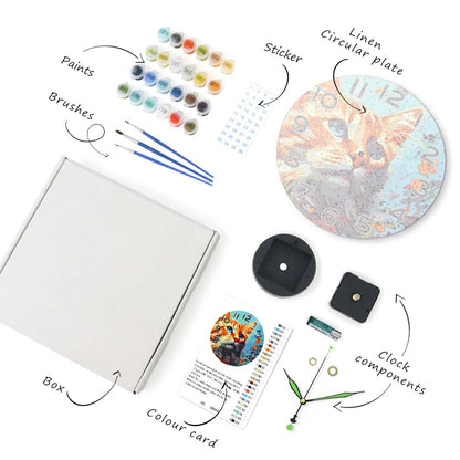 Set of art supplies including paints, brushes, a box, a color card, a clock with a cat design, and other components on a white background.